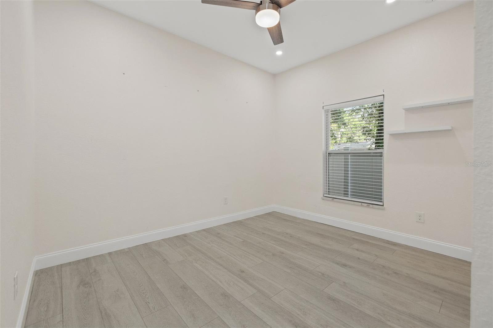 Bedroom 1 - remote ceiling fan / light combo.