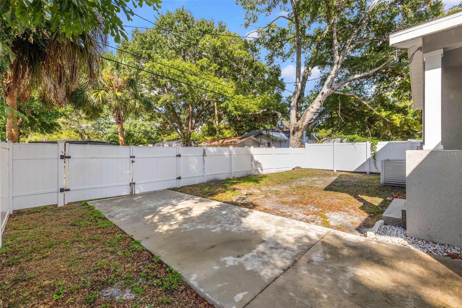 Large backyard with additional parking and alley access