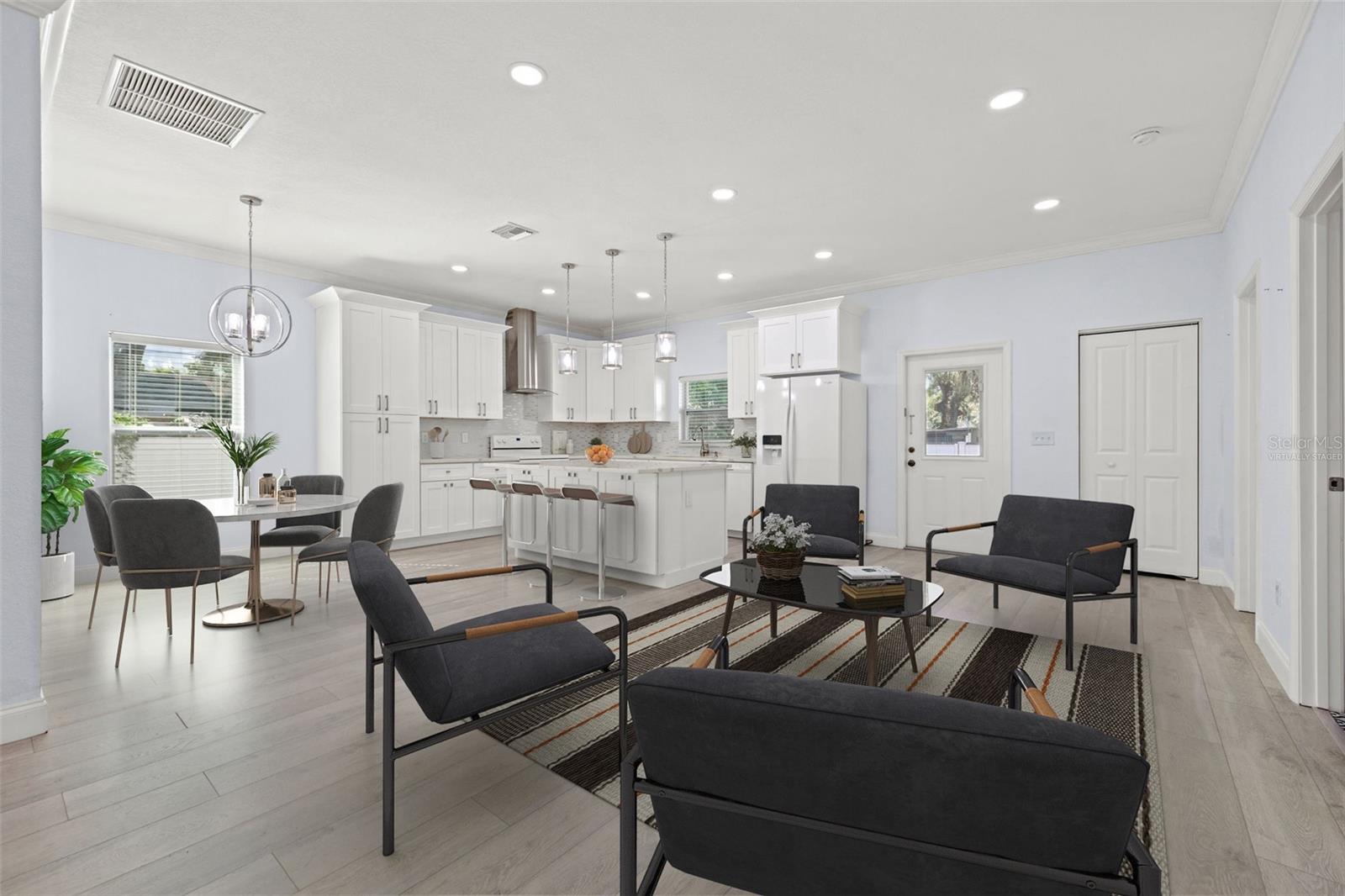 Virtually staged - open concept space next to the kitchen area.