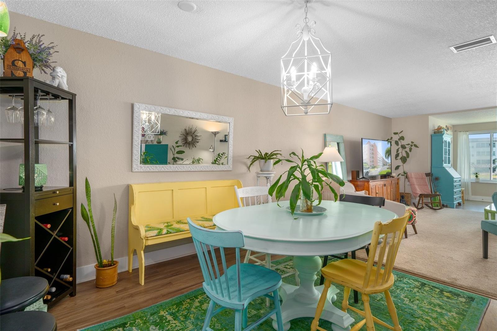 The spacious dining area is filled with light from both ends of the home.