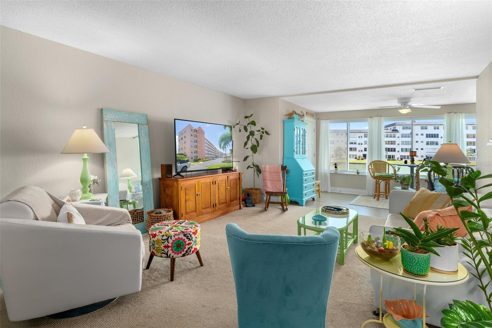 The large living area opens to the Florida room, granting you views of the amazing waterfront through the home.