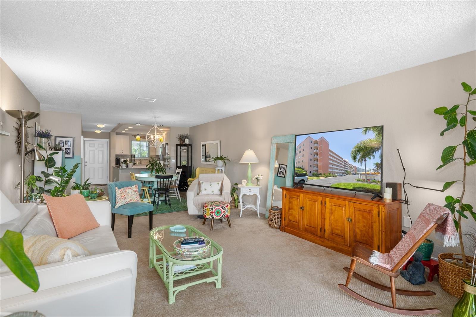 Looking into the unit from the Florida Room, you'll notice the ample space in the open living and dining area.