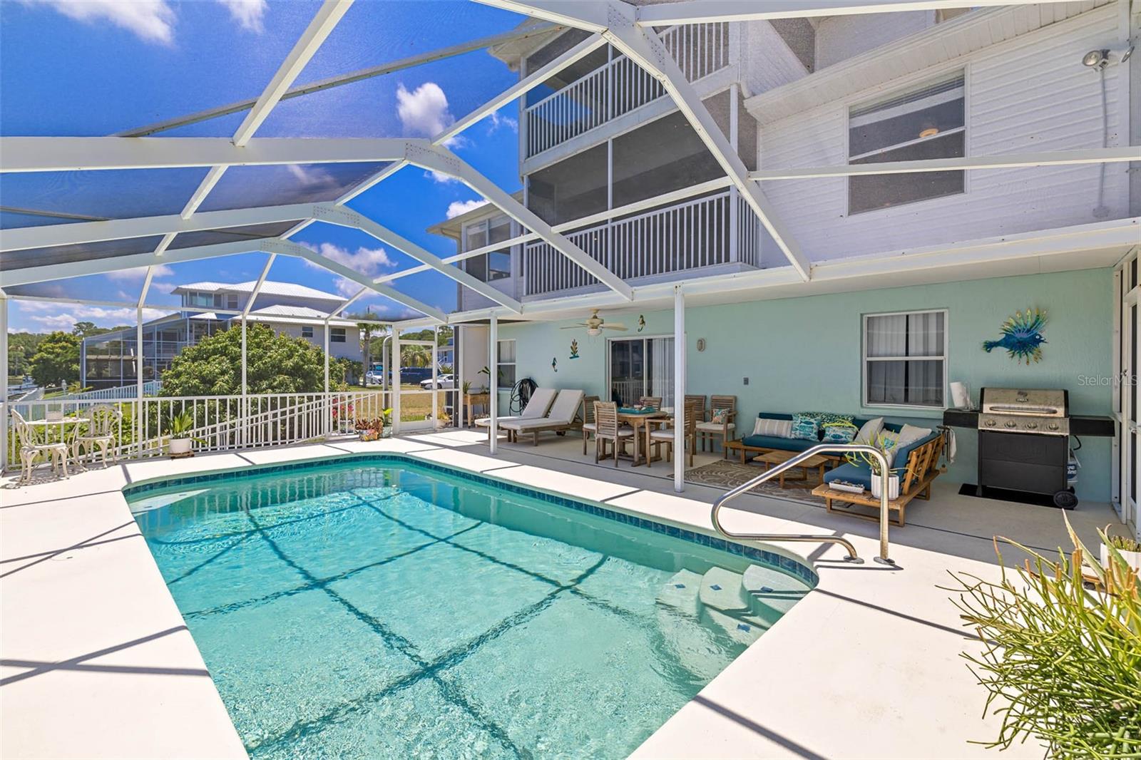 Pool with screened enclosure.