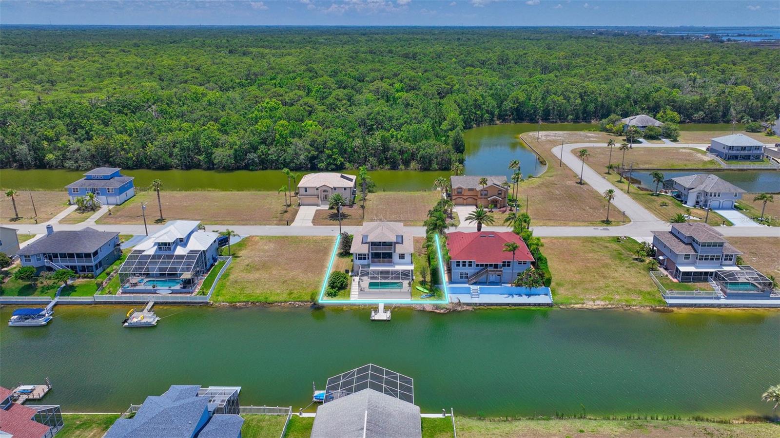 Aerial view of canal and residence from rear.