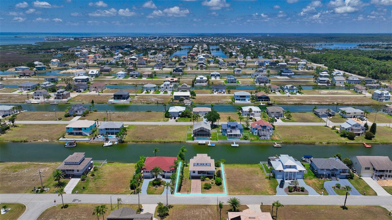 Additional aerial view of canal and location of residence.