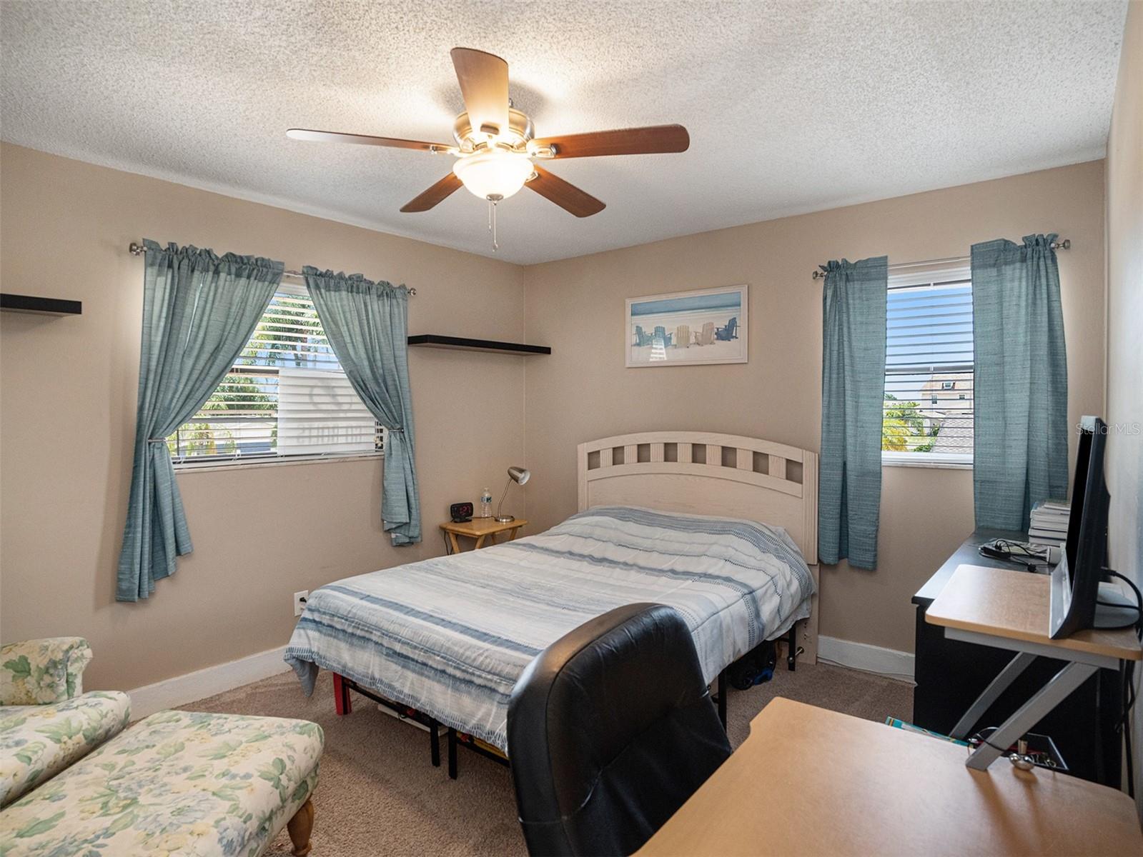 Three additional well-sized bedrooms provide comfortable spaces for family and guests.