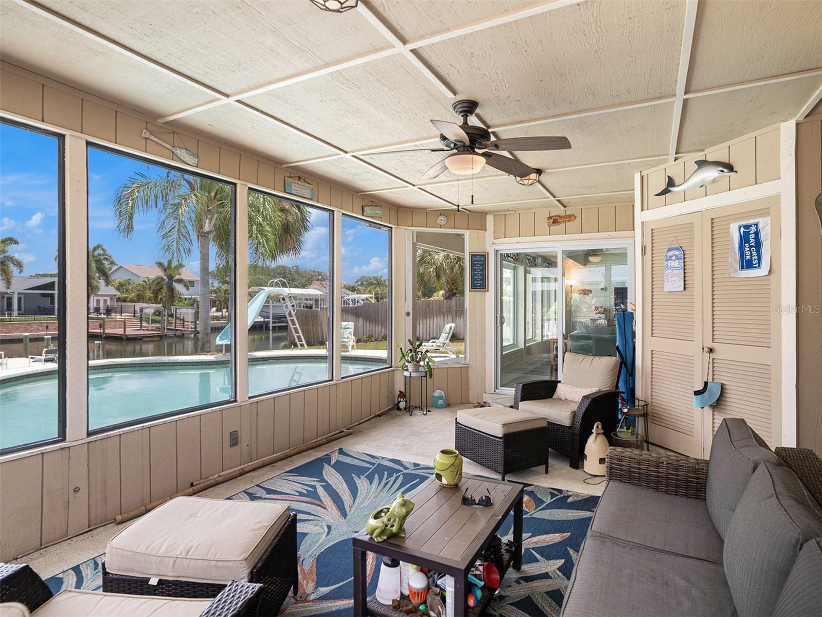 Extend your living space in the spacious sunroom patio by the pool!