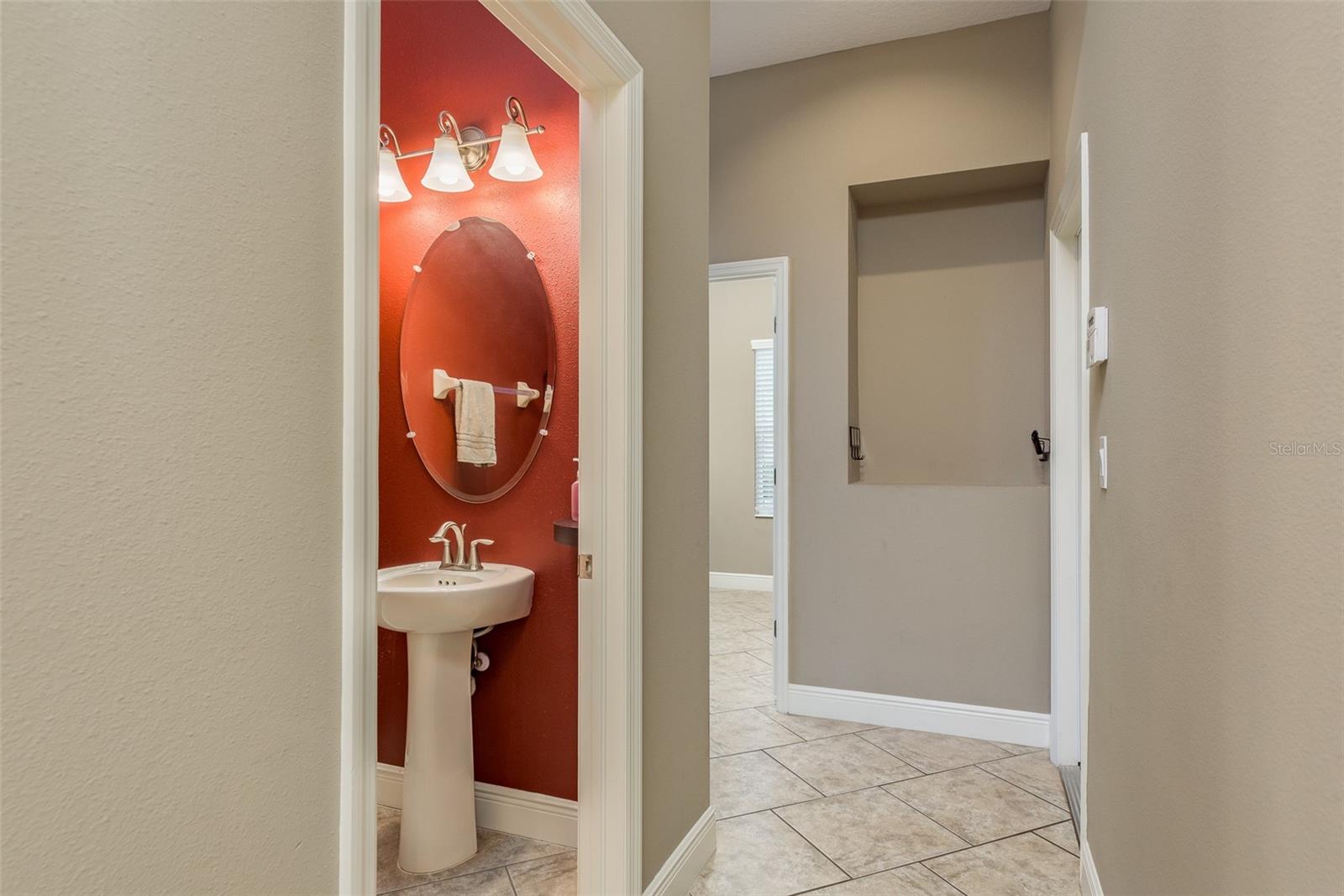 Hallway under stairs to 1/2 bathroom