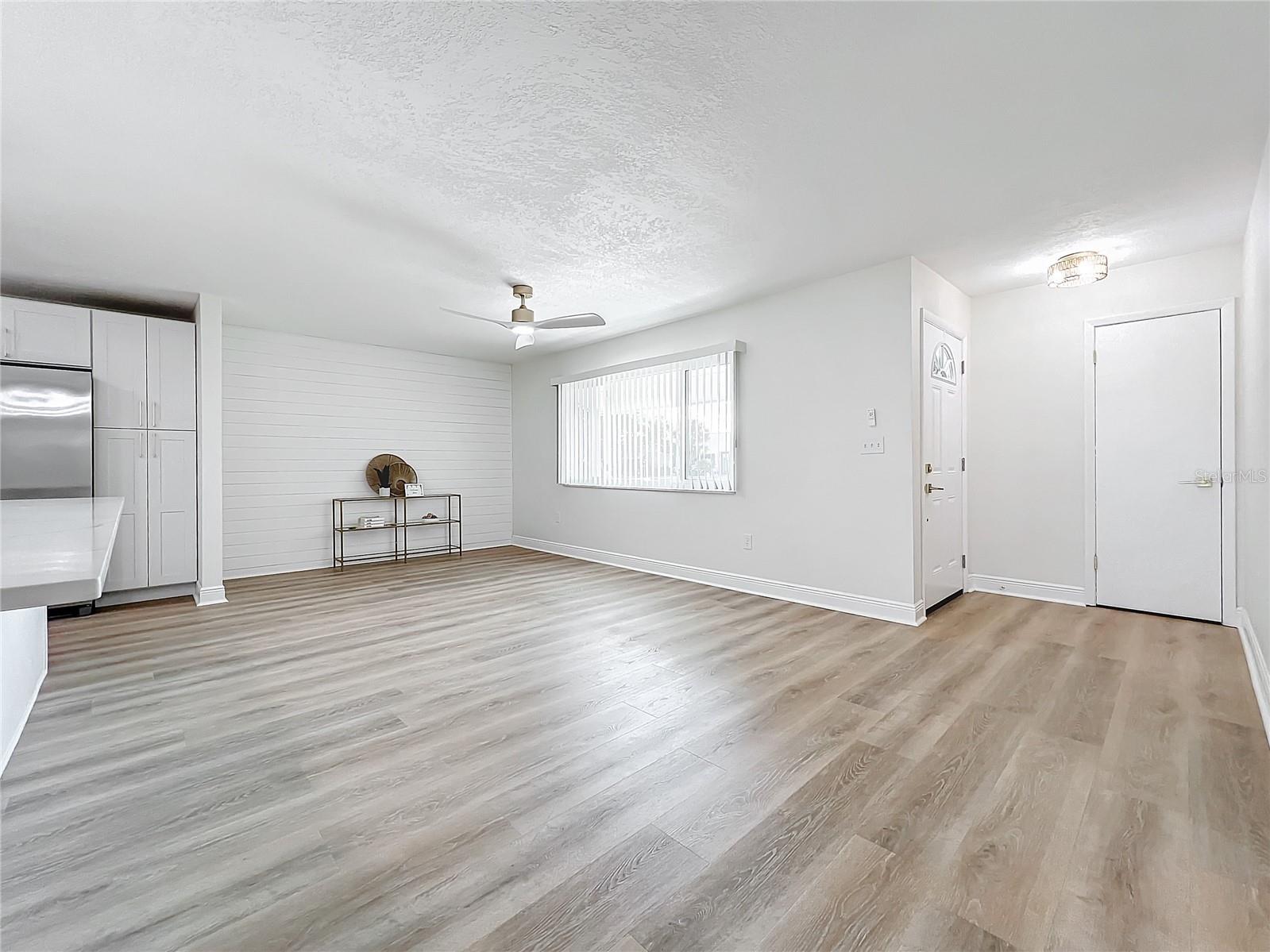 LIVING ROOM WITH CUSTOM SHIPLAP WALL