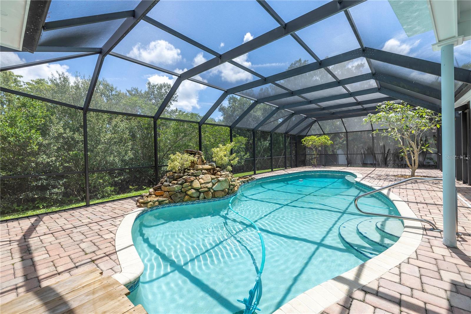 Screen enclosed pool & paver patio