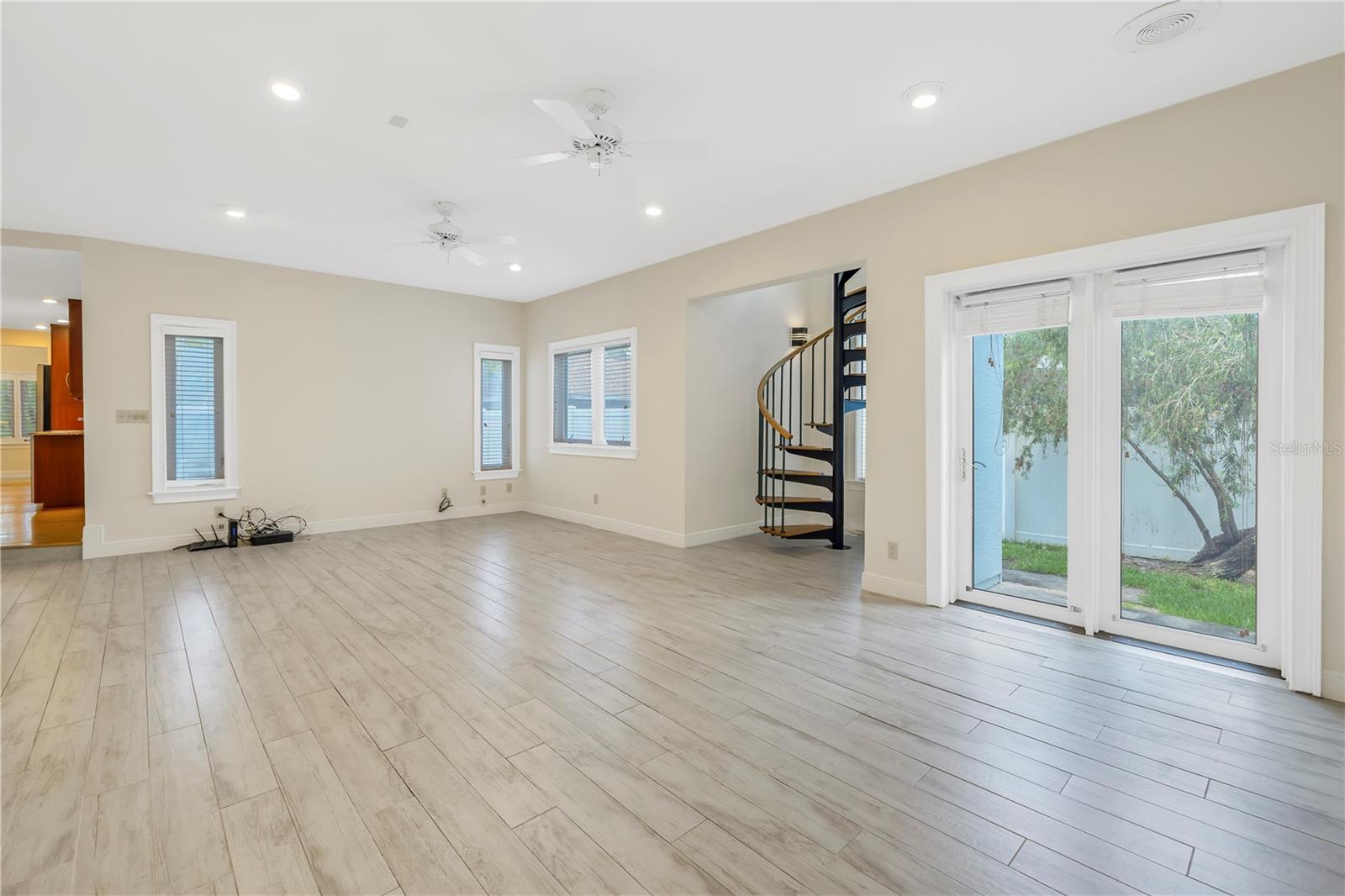 Family room just off the kitchen with access to the secure, fenced yard