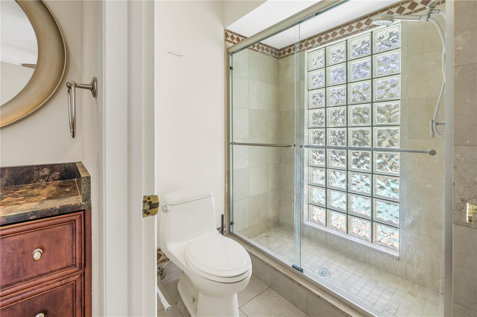 Shower and vanity in the first floor bedroom suite