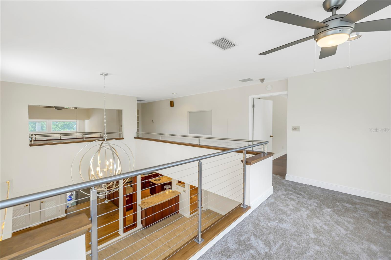 Upstairs loft leading to the main bedroom suite