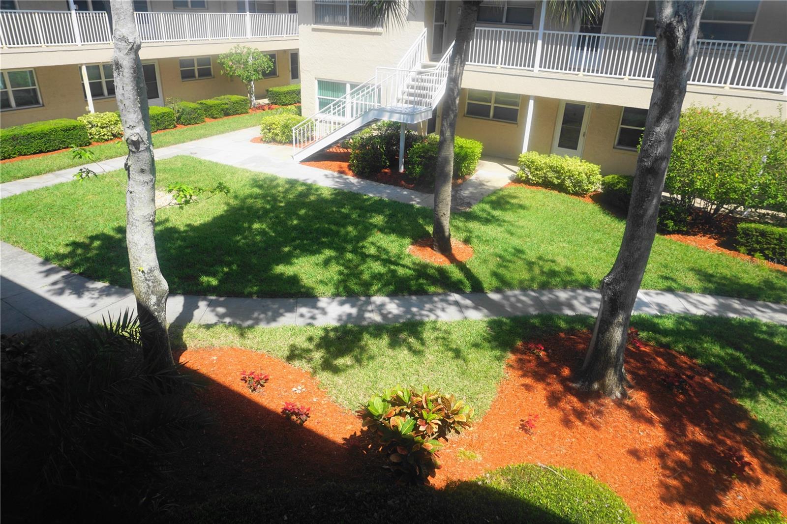 Front door overlooks a beautifully landscaped courtyard