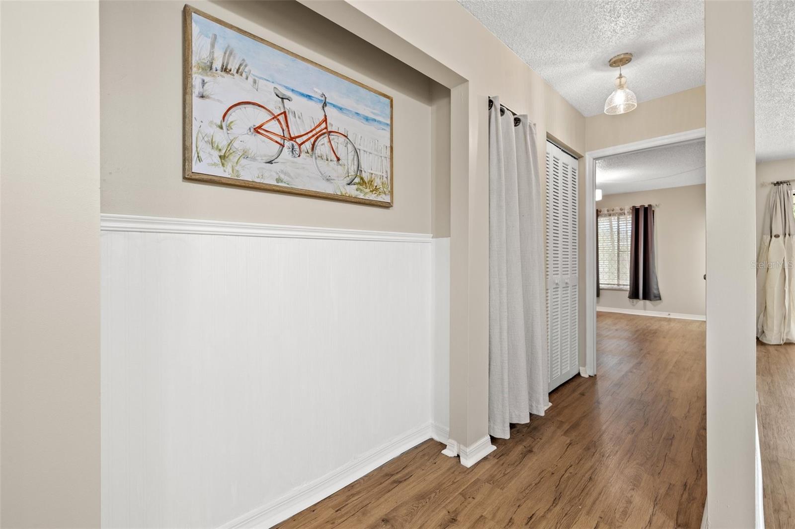 Hallway with interior laundry