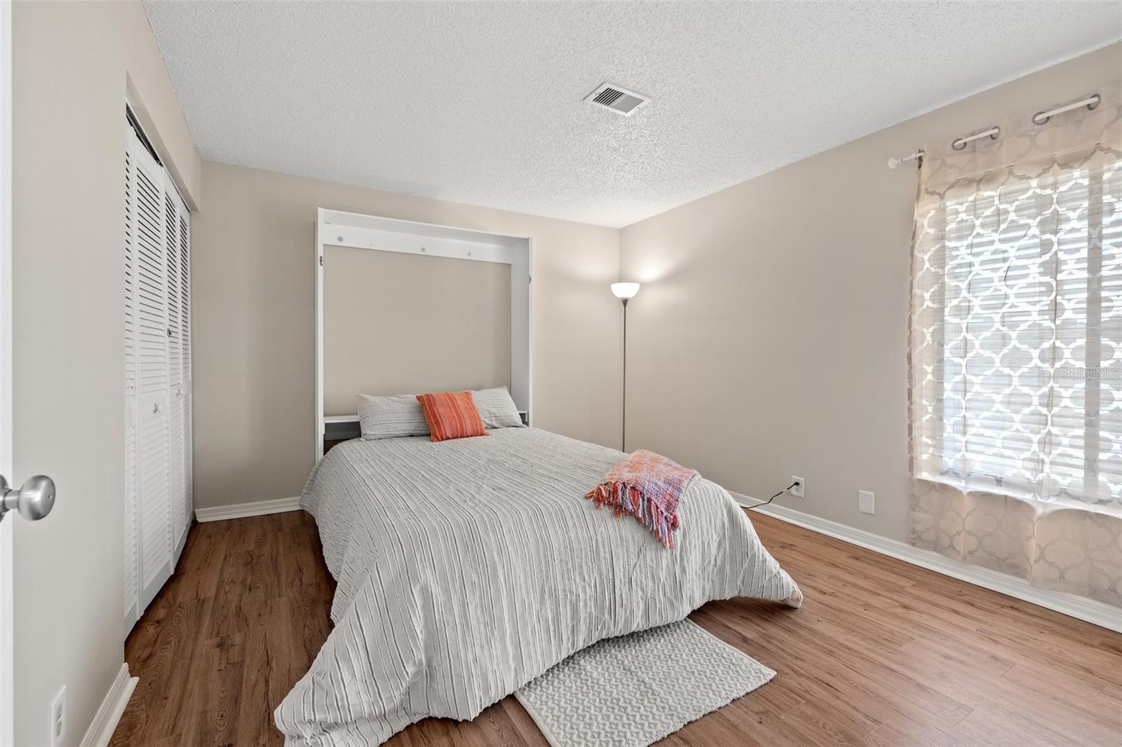 Guest bedroom with built in Murphy Bed