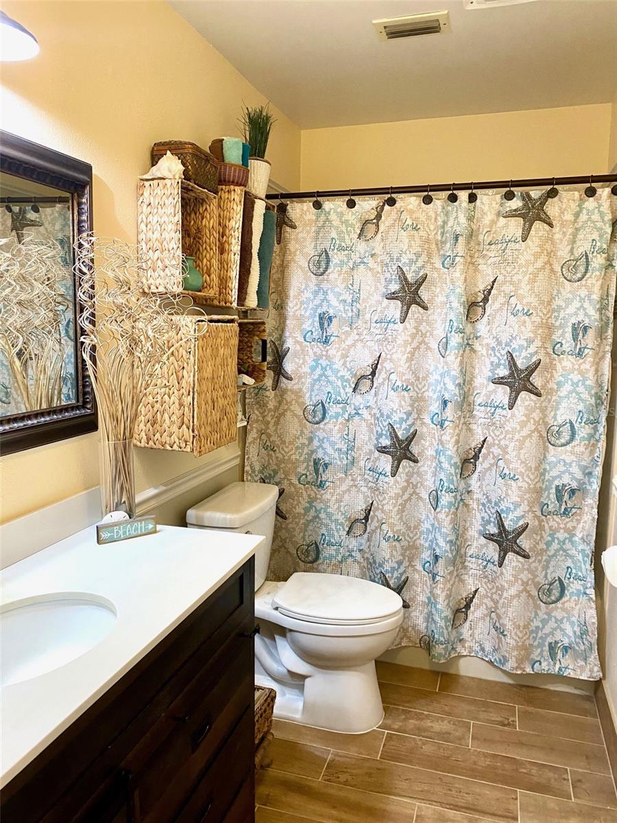 Master Bath has a tub and hand rails