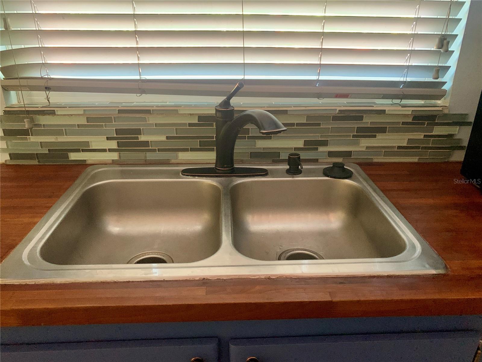 Kitchen Sink w/backsplash and bronzed faucet