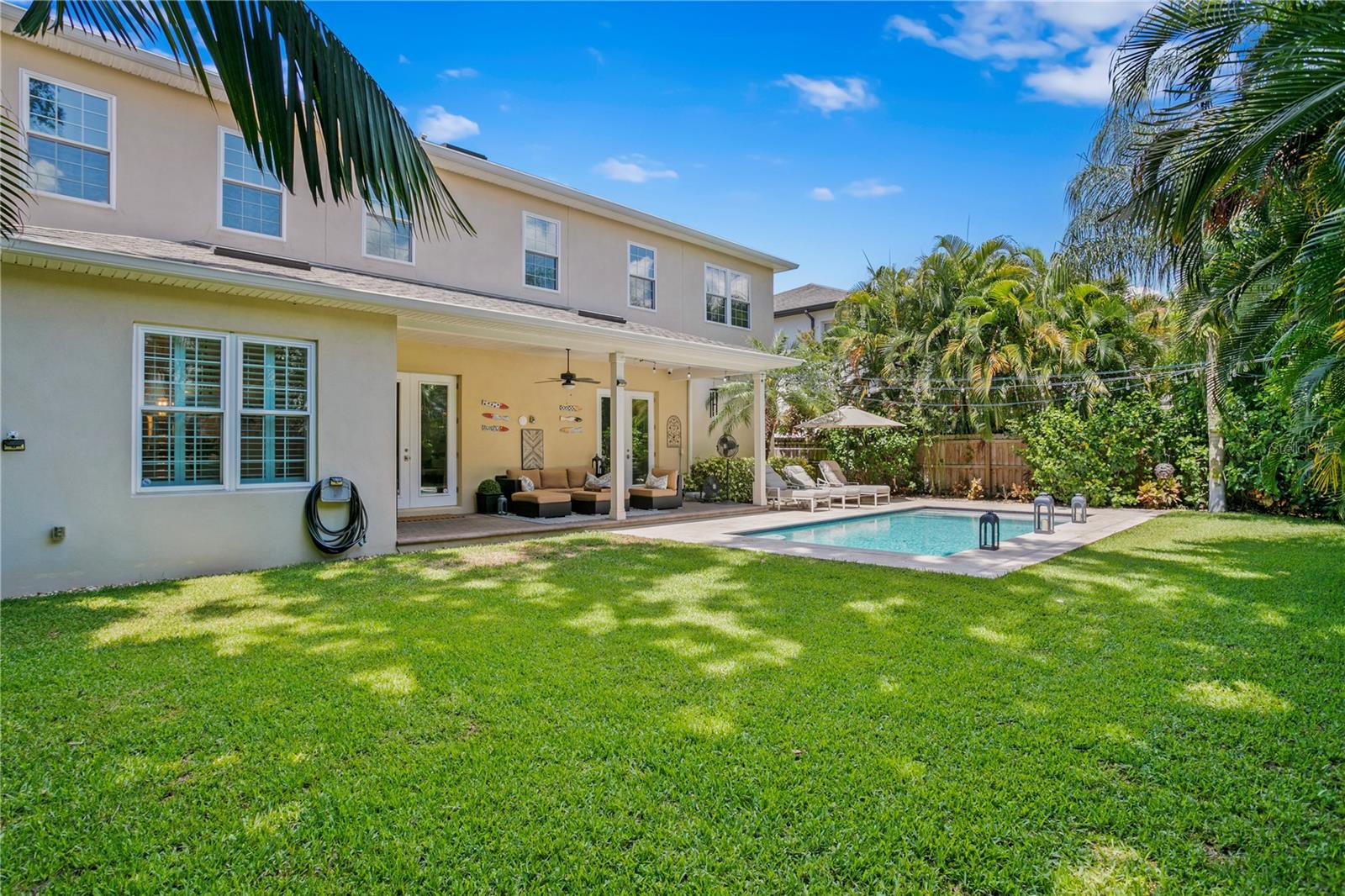 This home sits on a large lot where the backyard encompasses both a pool and greenery for a soccer net, playset, or space for our furry family members to play.