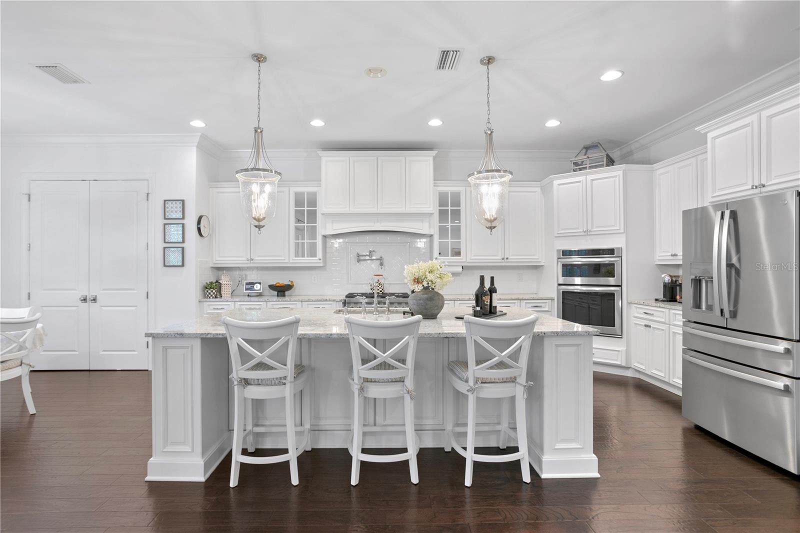 The spacious and open kitchen with an oversized island with storage