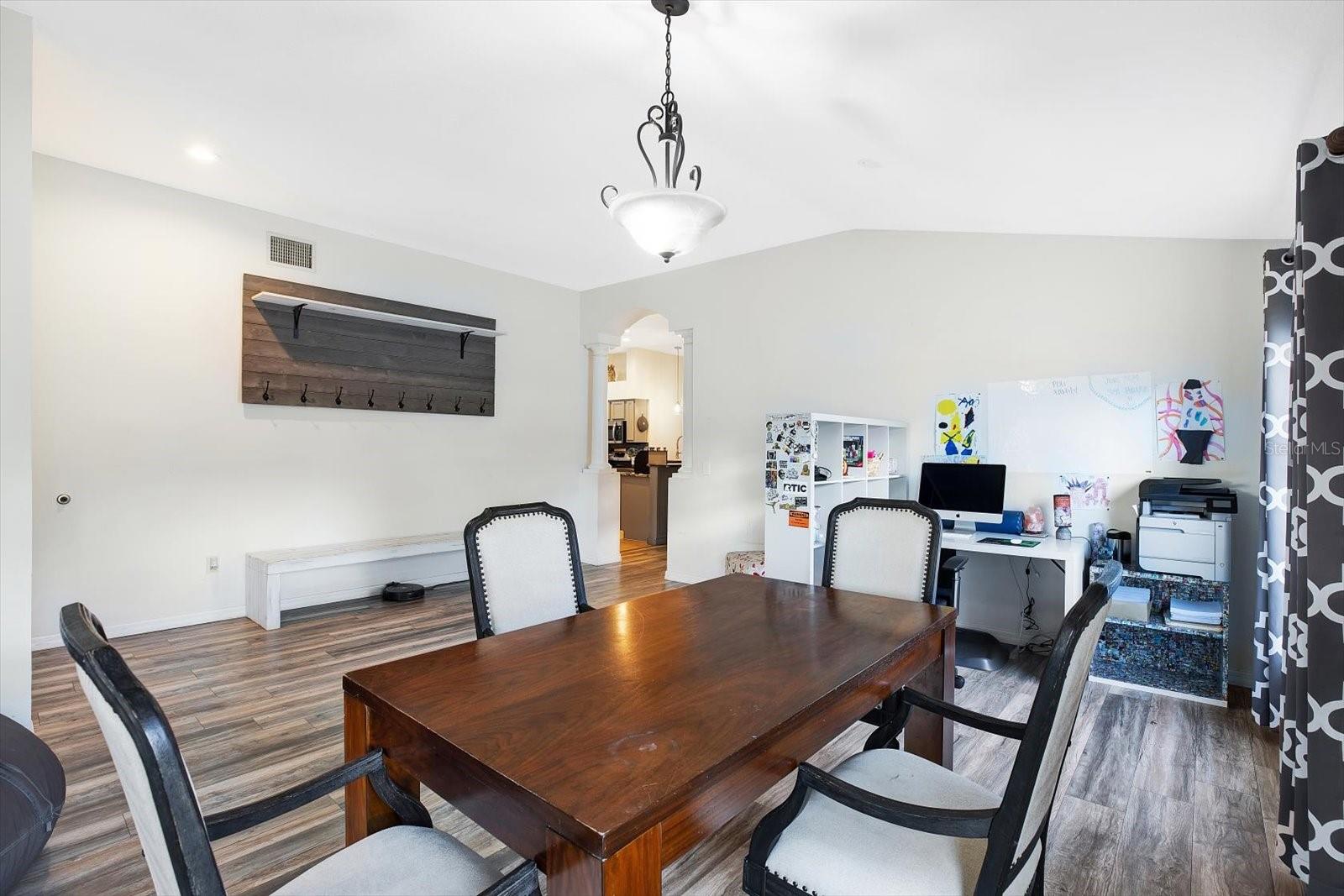 This room can serve as a dining room and living room