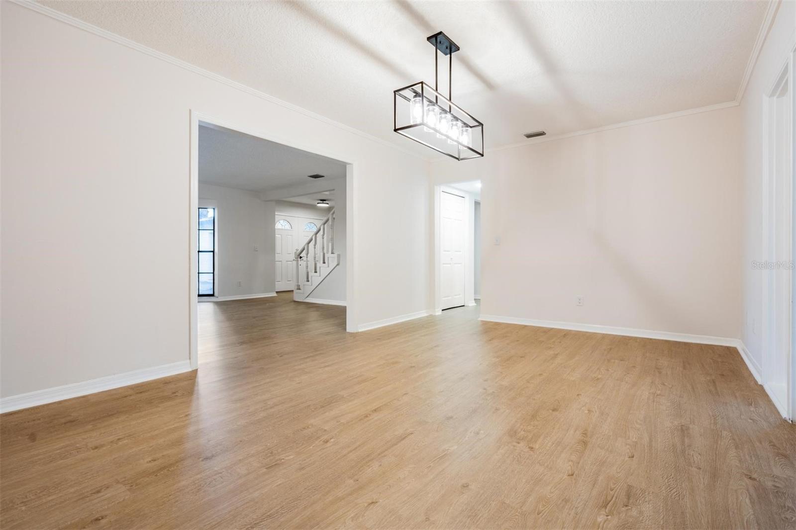 Formal dining room view toward kitchen