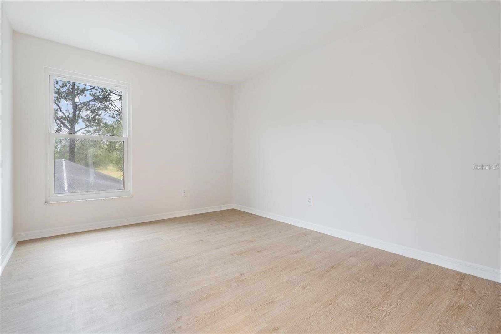 Bedroom 2 off of loft with view of the golf course