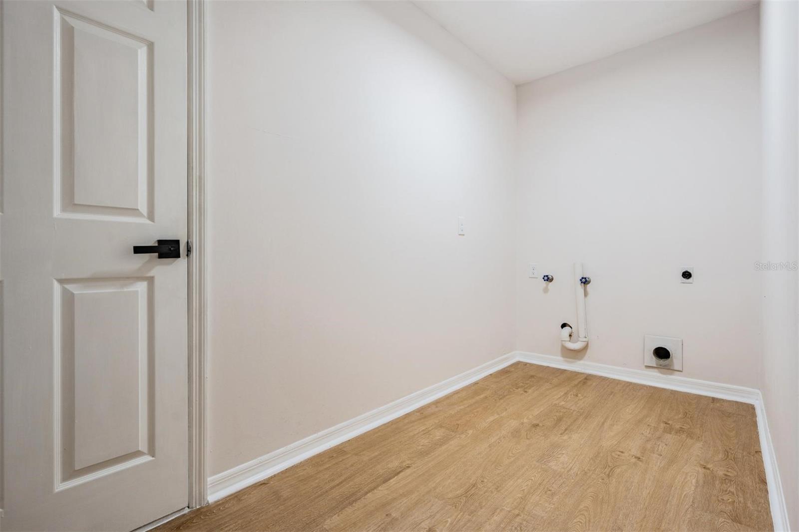 Spacious laundry room downstairs off of garage