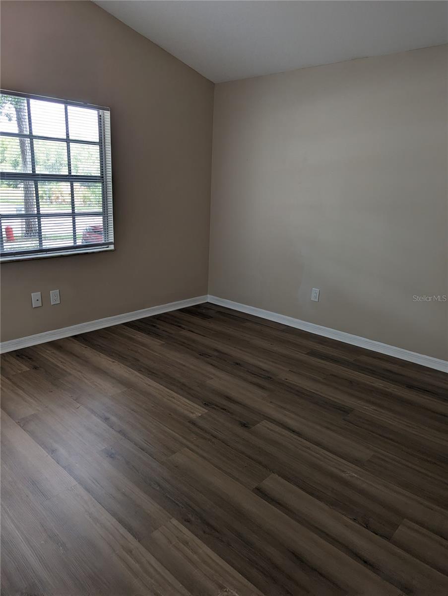 front bedroom with laminate flooring.