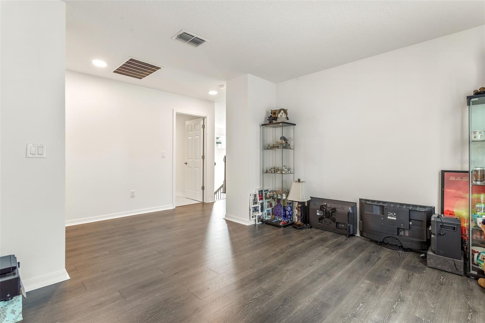 This huge space could be closed off with double doors to make this a separate room.