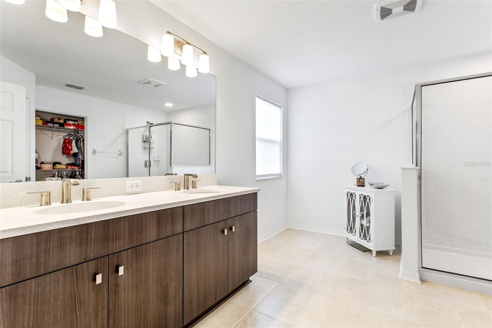 Ensuite bath of the primary has a standing shower.  This open space is great for a cold plunge, sauna, add a bathtub or whirlpool, or use as a vanity/get ready nook.