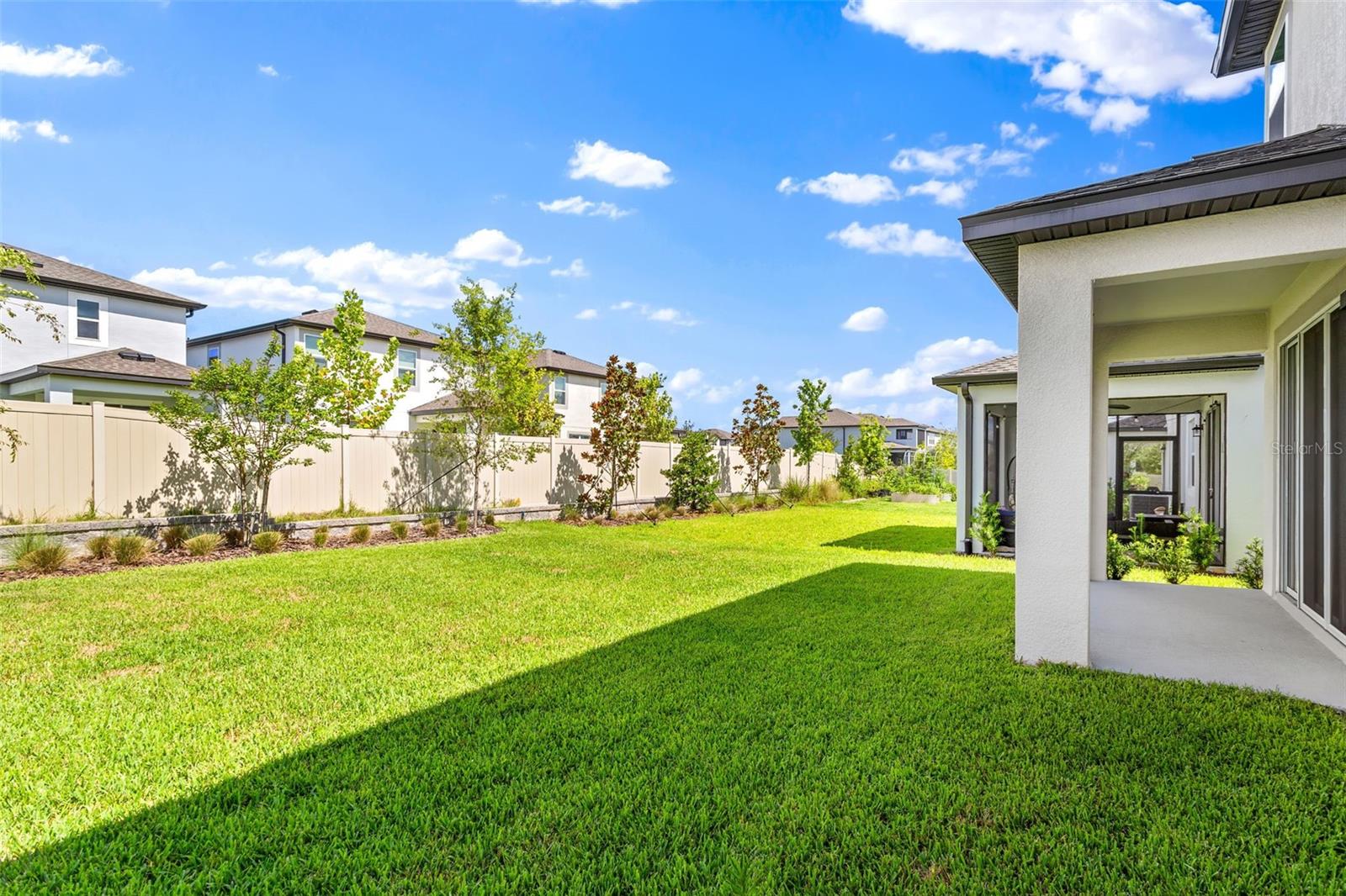 This area has a retaining wall as a natural back barrier for privacy- fence would connect on L and R.