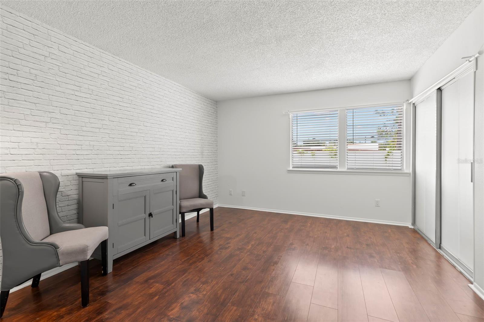 Primary Bedroom with sliders to the enclosed porch