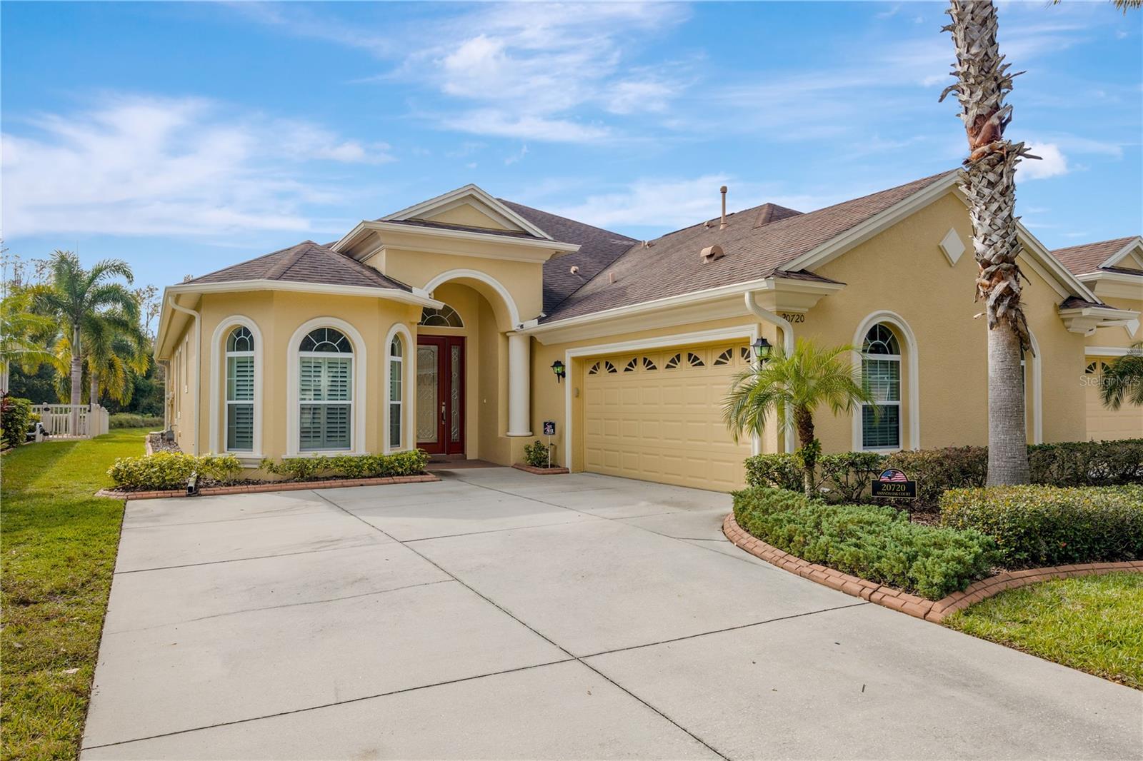 Bay window with plantation shutters and large 2 car garage