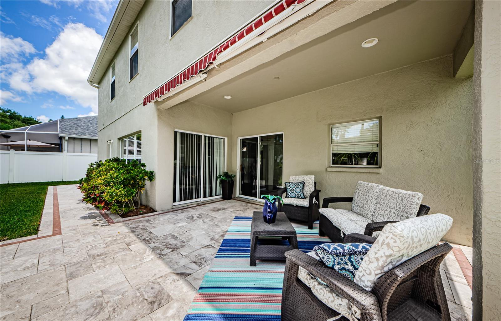 Pavered patio with electric awning