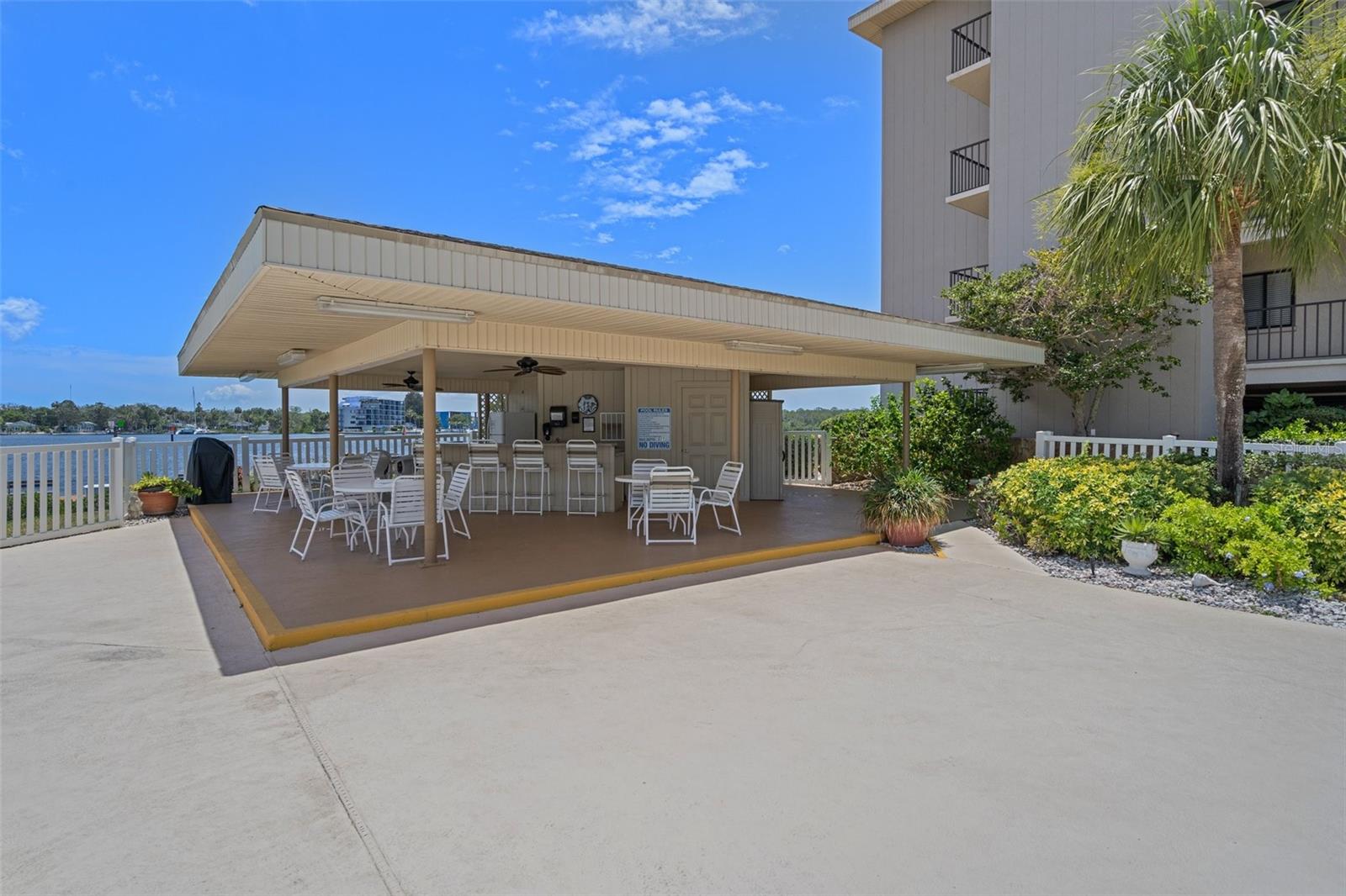 Cabana by building 3 with gas grill and seating