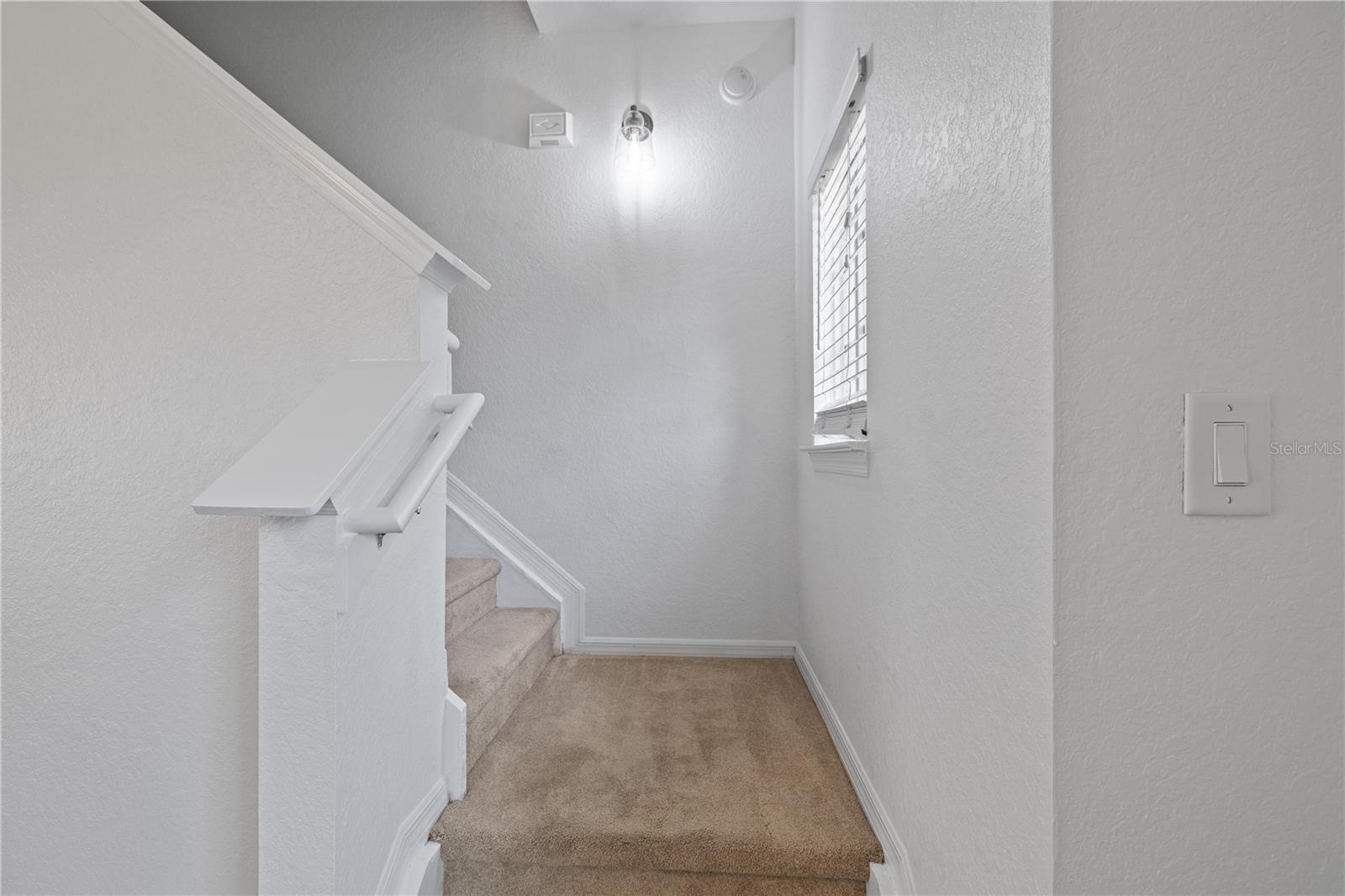 Stairs to Primary Bedroom and Bath