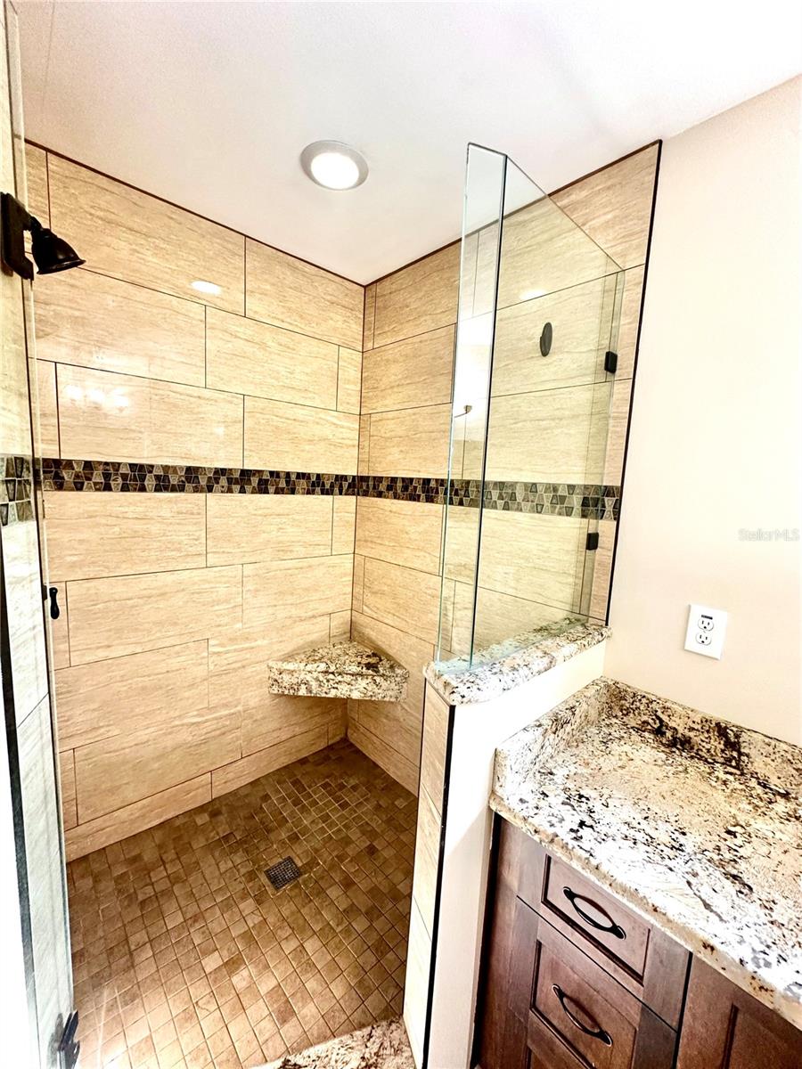 Primary Bathroom with granite countertops