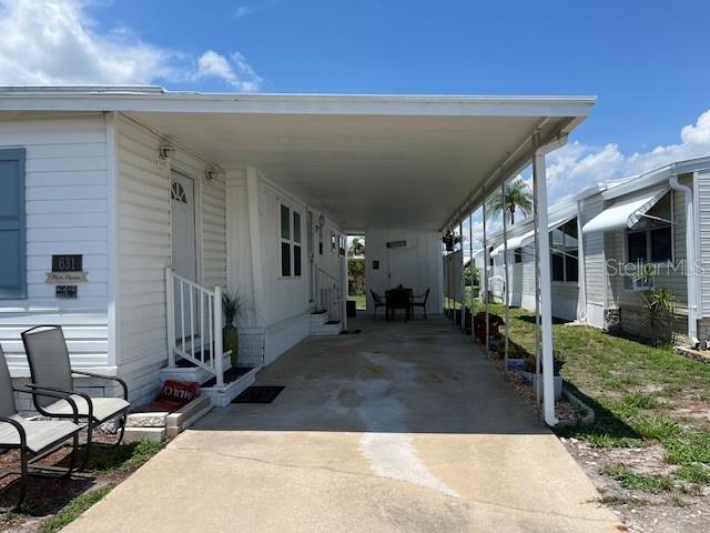 Carport, storage shed with washer & dryer.