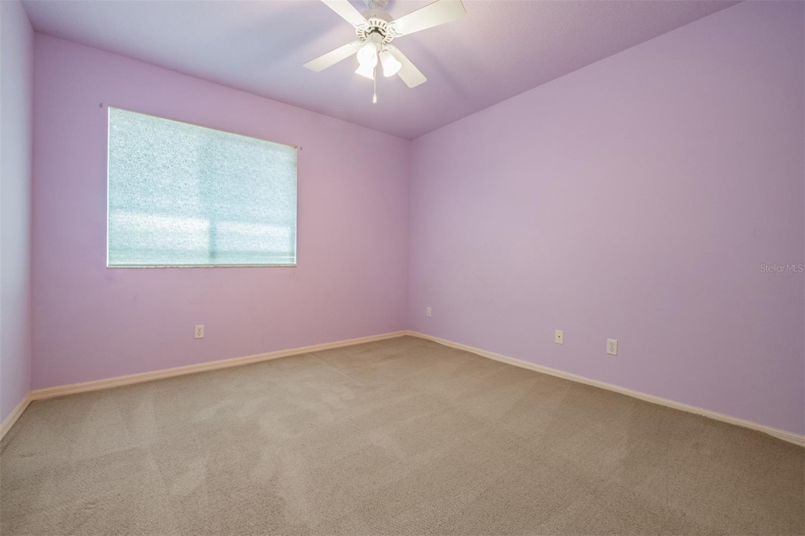 Guest Bedroom with ceiling fan.