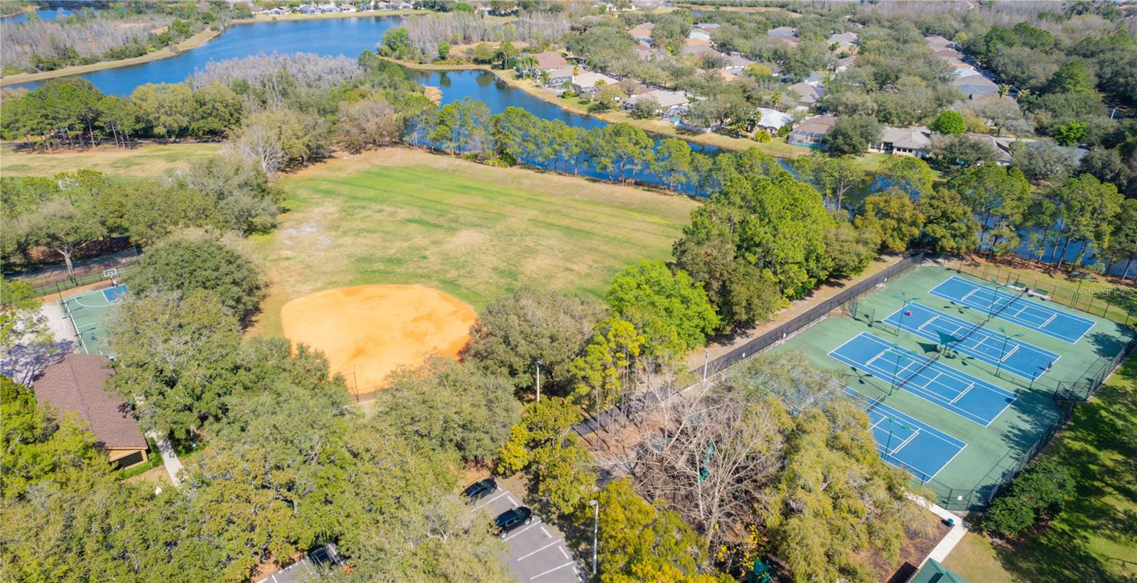 Baseball field, tennis courts and pond