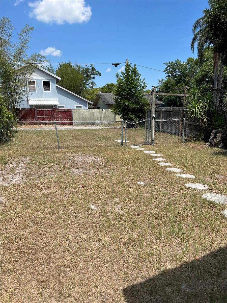 Alleyway access to Fenced in back yard & parking spaces.