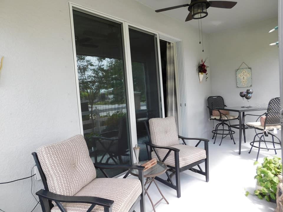 Triple slider off the living room leads out to this wonderful Screened rear lanai