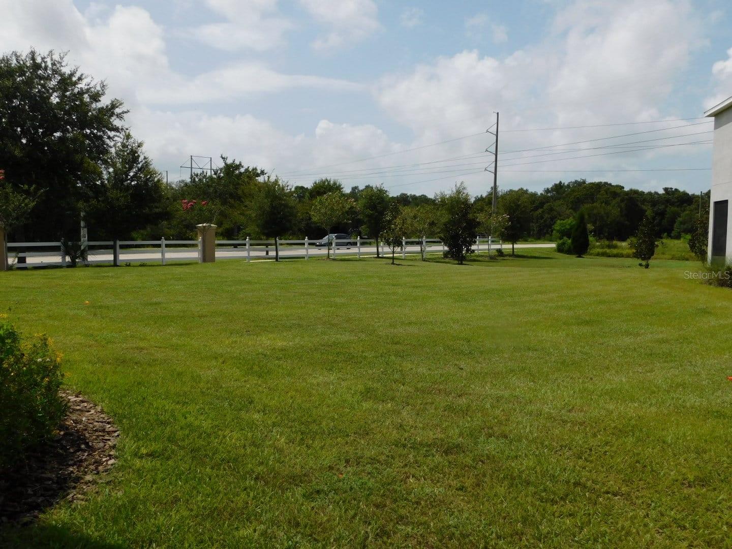 Large Vacant lot to the right of the home.