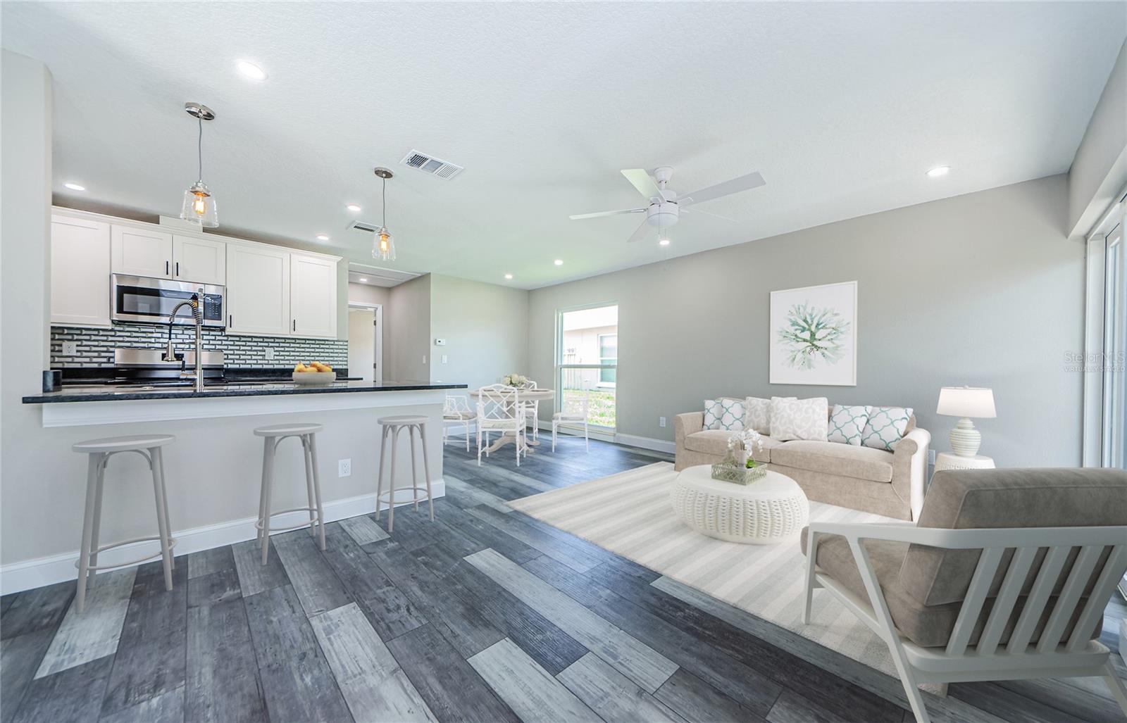 Kitchen and Virtually staged Living/Dining Room