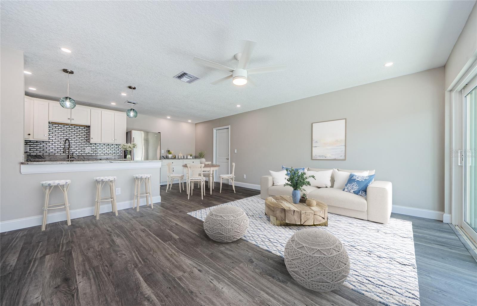 Kitchen and Virtually staged Living/Dining Room