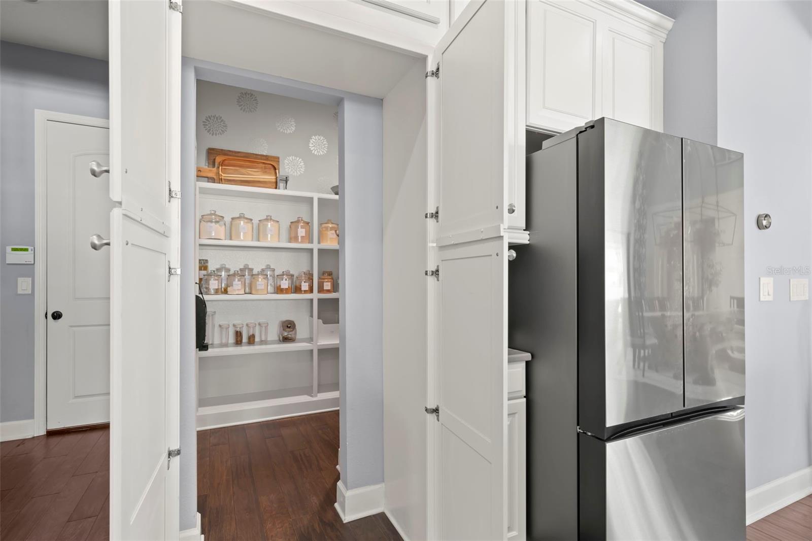 Hidden walk-in pantry in kitchen is huge!