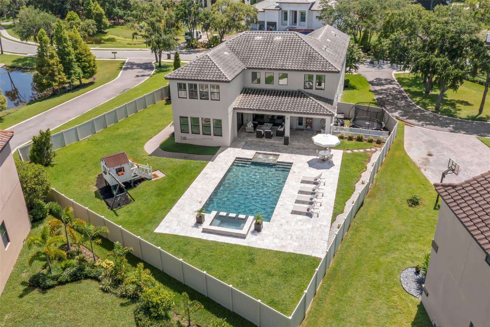 Beautiful pool in backyard with plenty of yard space to run and play