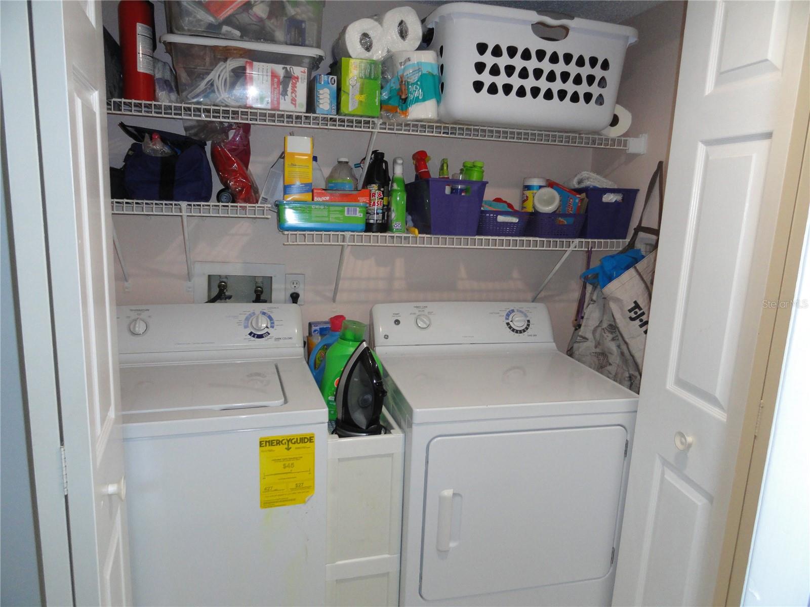 Washer/dryer closet off hallway in main living area.