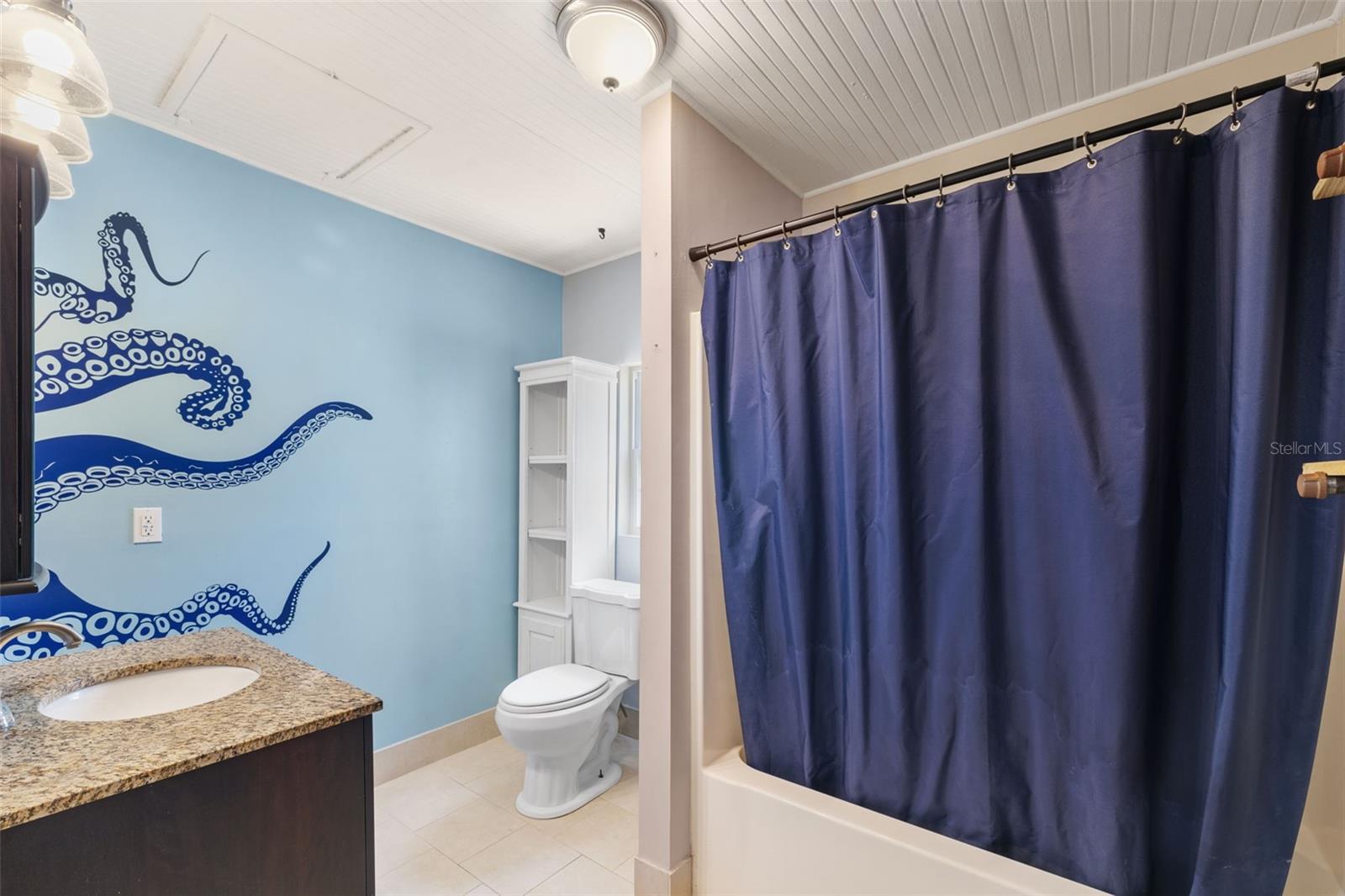 Ensuite bathroom with removable octopus graphics. (It's just a decal)